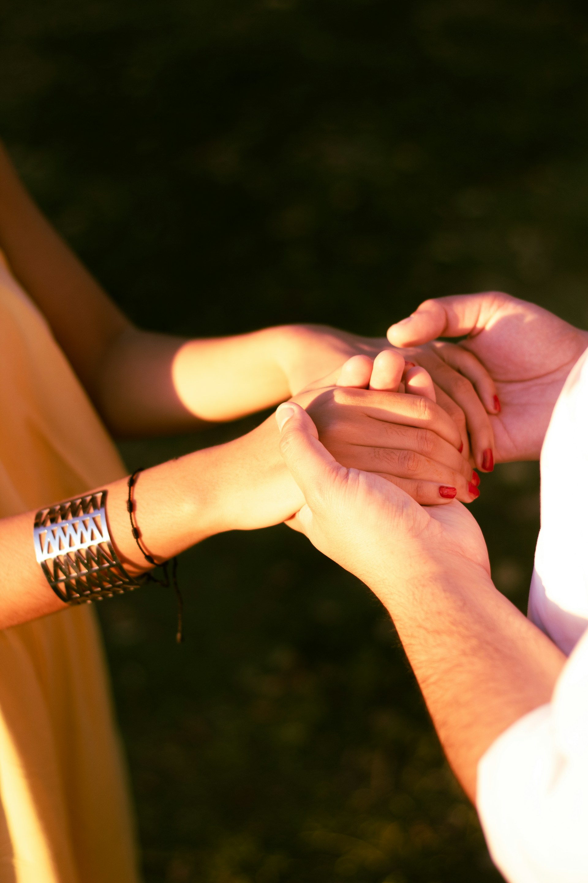 Couple holding hands with affection and support.