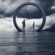 People stand inside a clock on the water.