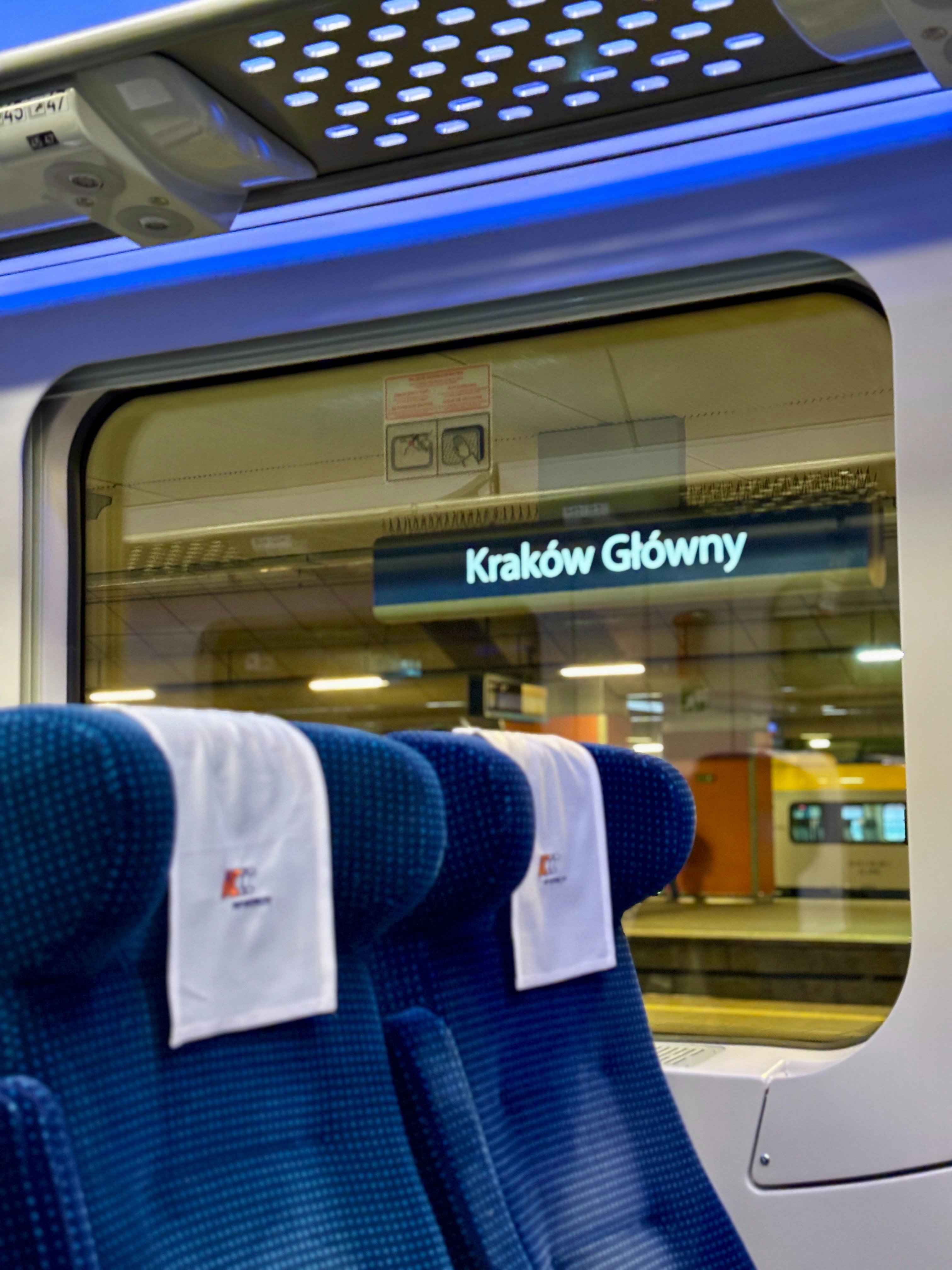 Inside a train, arriving at kraków główny station.