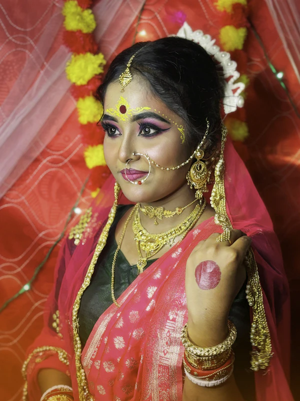 Indian bride with elaborate makeup and jewellery