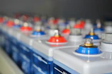 Rows of batteries with red and blue terminals.