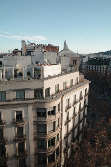 Buildings and rooftops under a clear, blue sky.