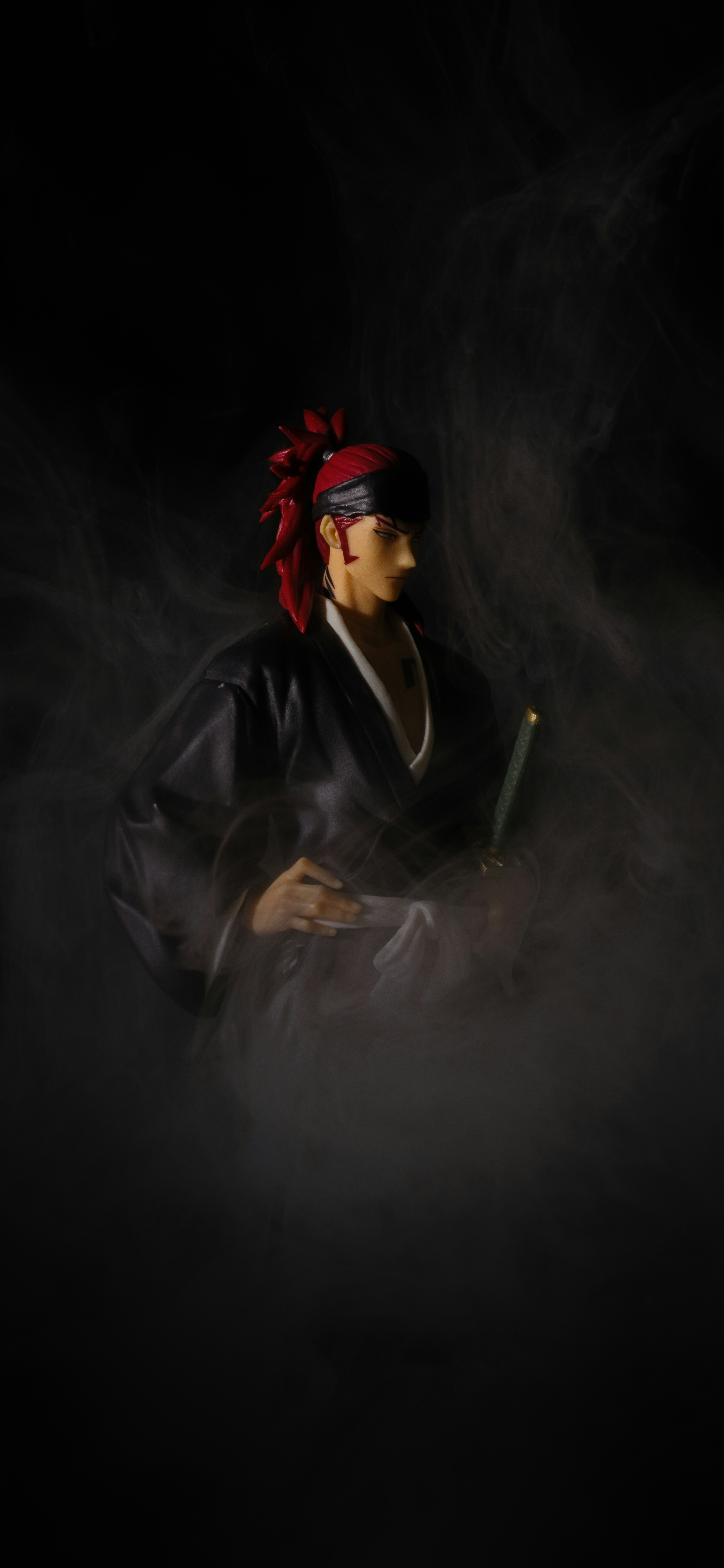 A figure of a character from an anime, surrounded by fog.