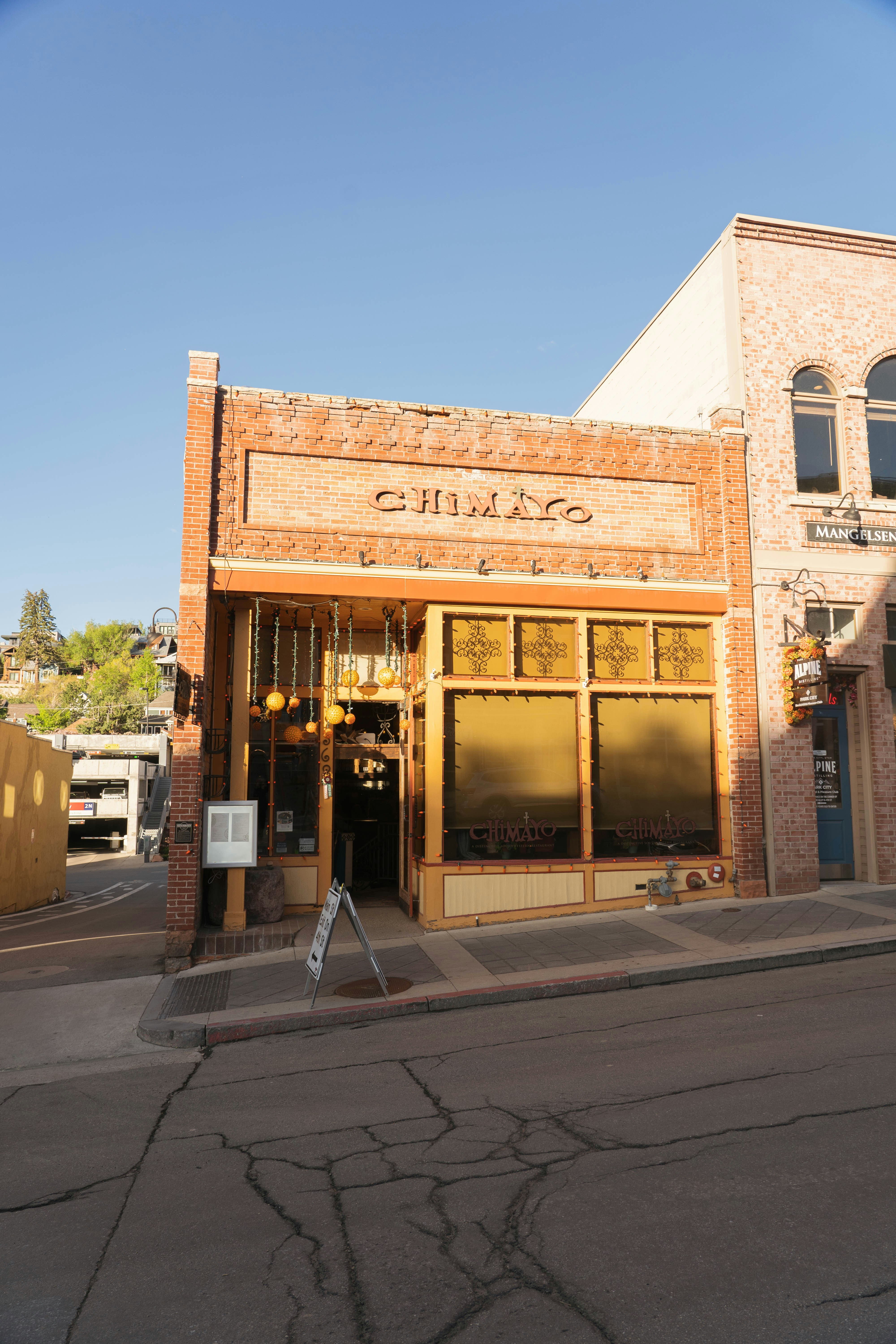 A brick building with "chimayo" above the entrance.