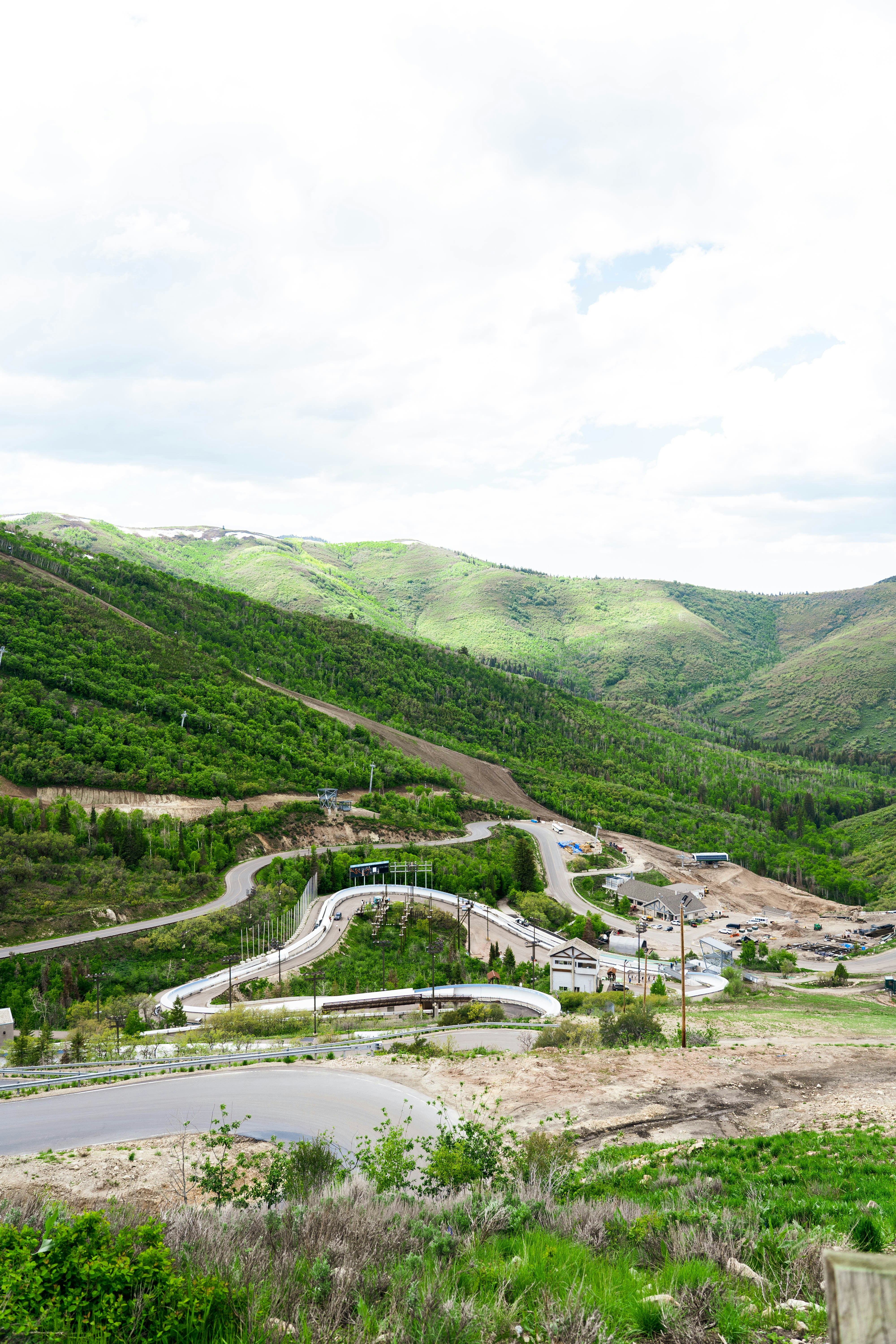 A winding road through lush, green mountain terrain.