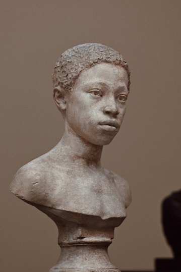 A bust of a young person is shown.