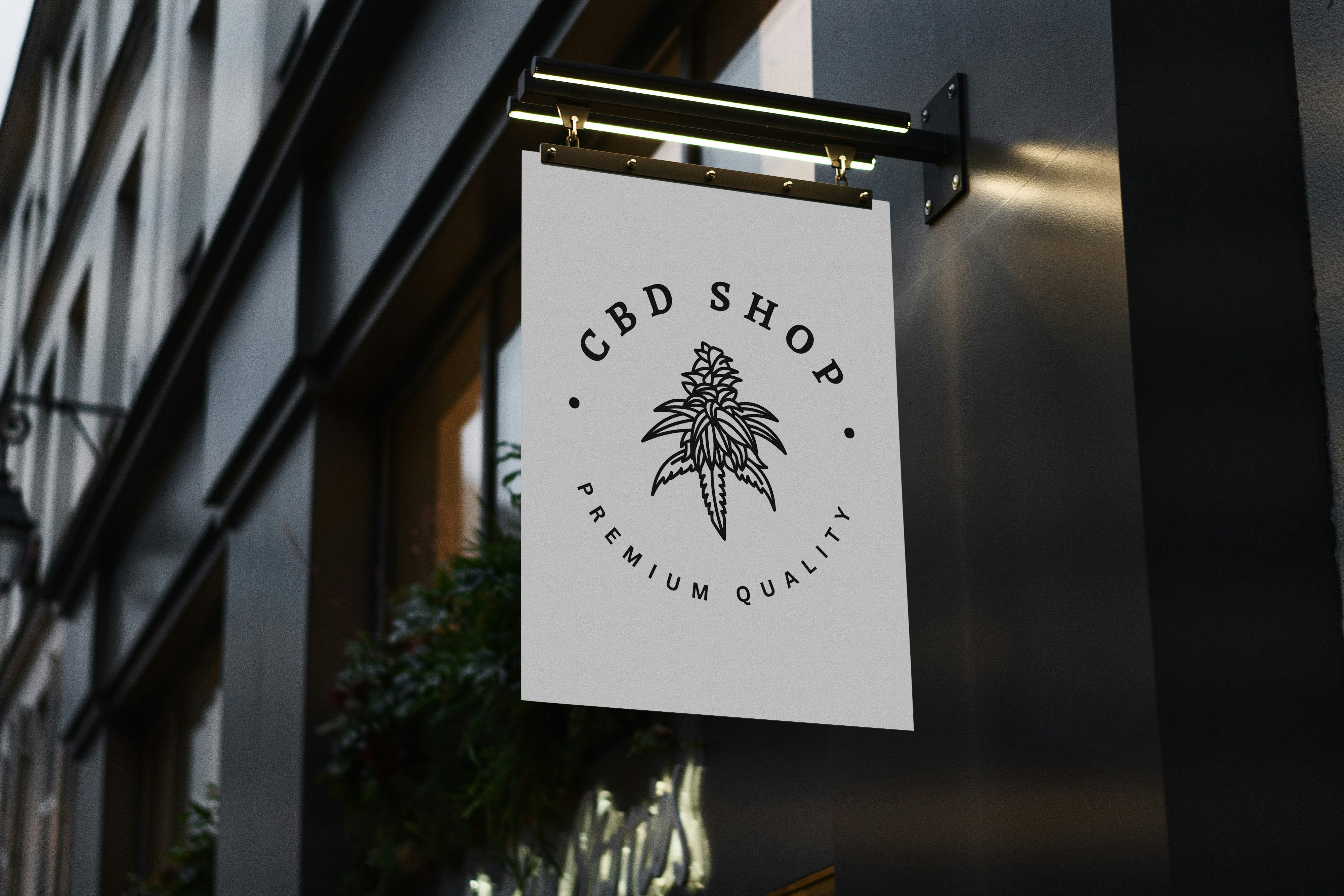 Ein CBD-Shop-Schild hängt vor einem Gebäude.