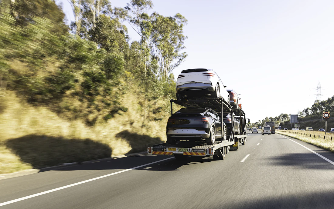 Car transporter on highway