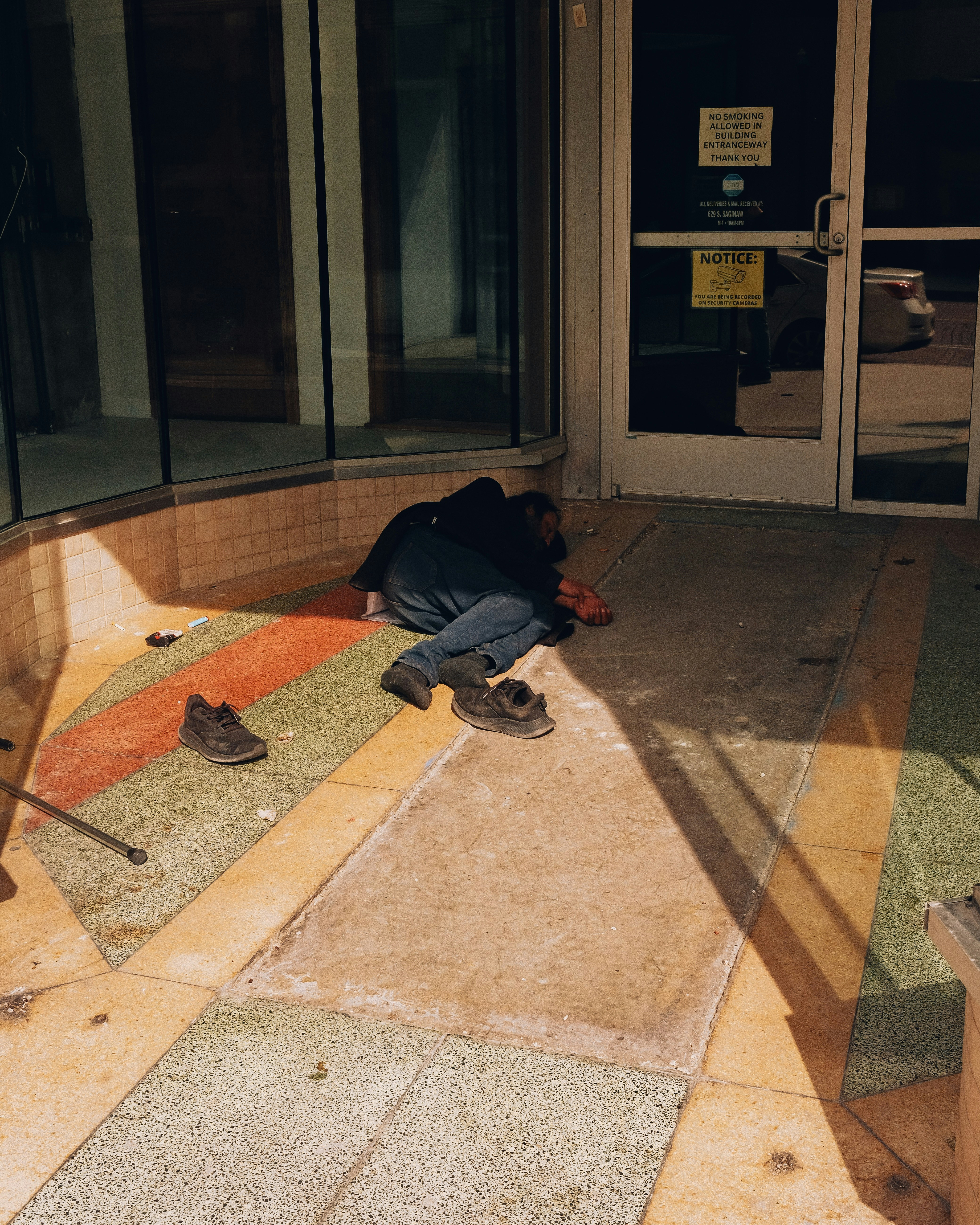 A person is lying on the ground outside