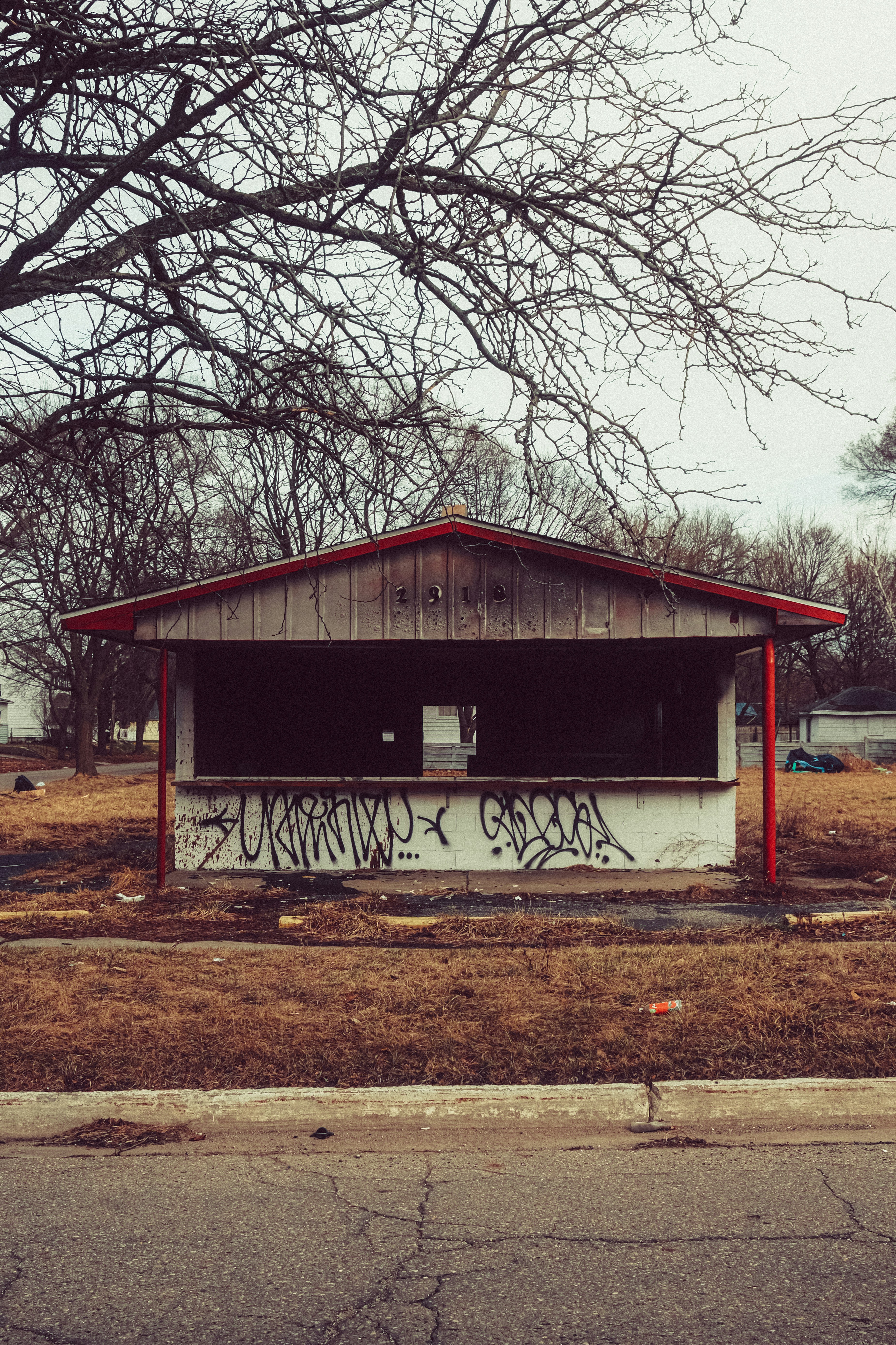 Abandoned building covered in graffiti sits