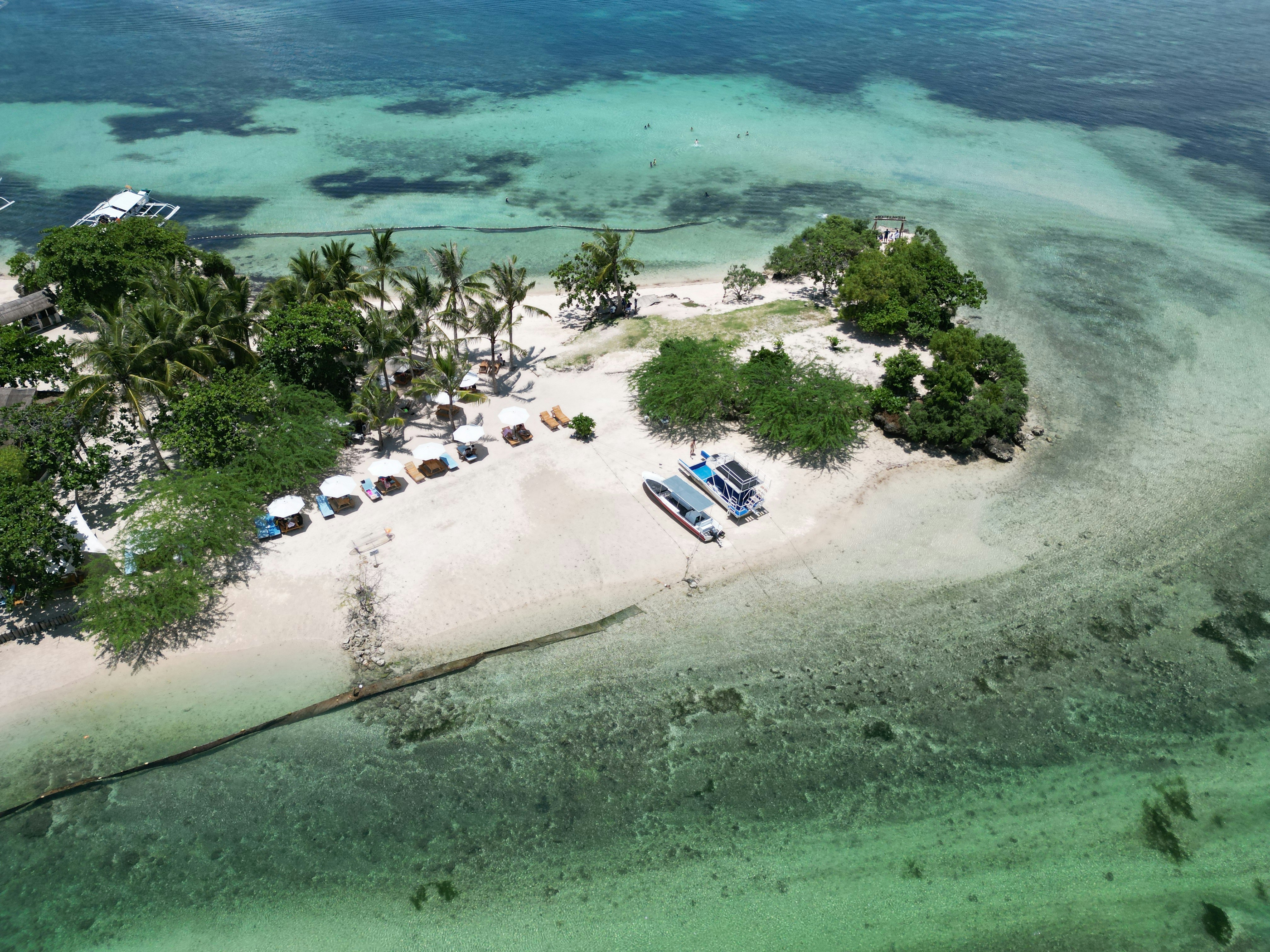 Aerial view of a tropical island with boats., aerial view of Bantayan Island, located in Cebu, Philippines