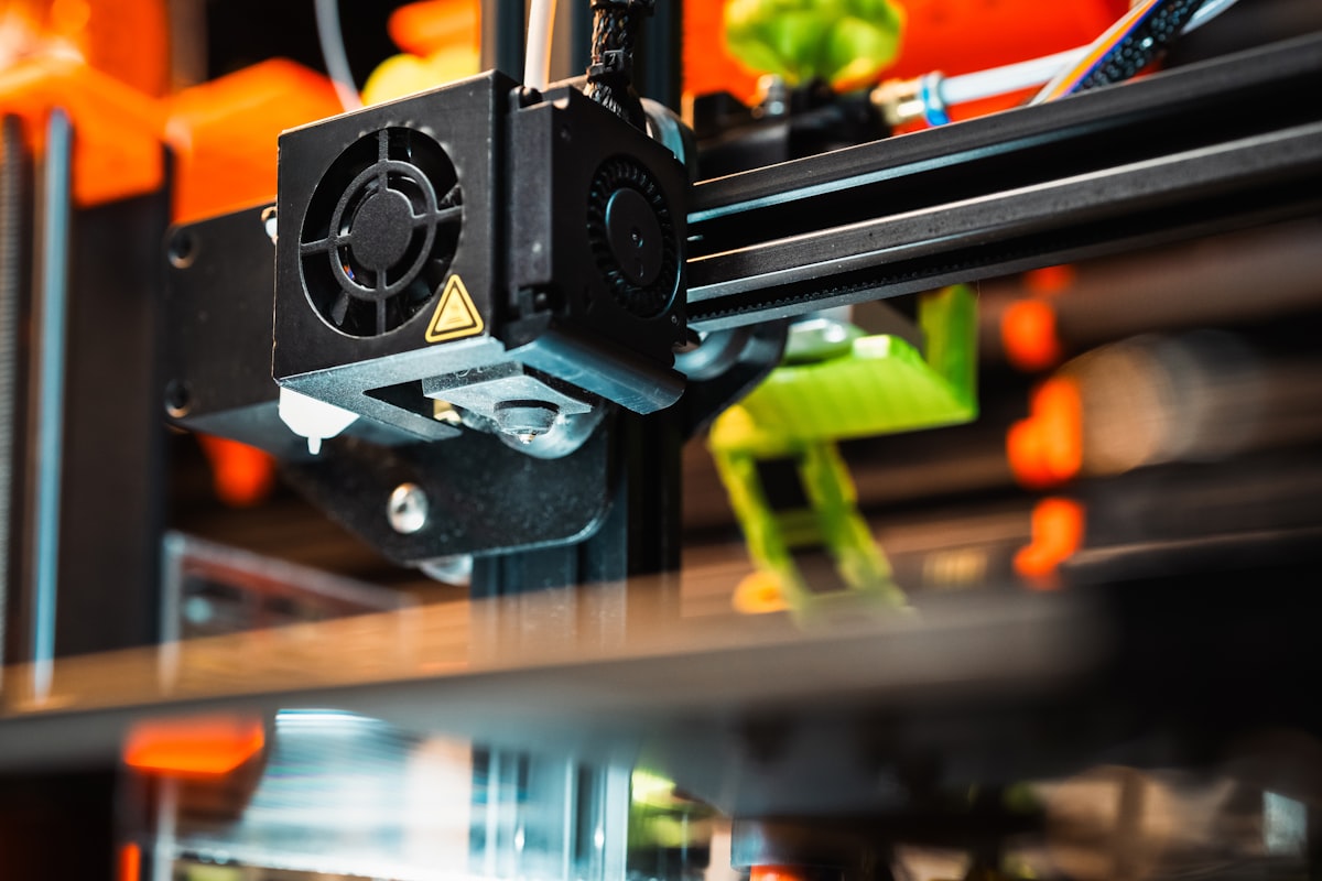 Best filament for Bambu X1 Carbon — close-up of X1 Carbon extruder and toolhead printing at high speed
