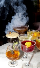 Elegant cocktails with smoky presentation.