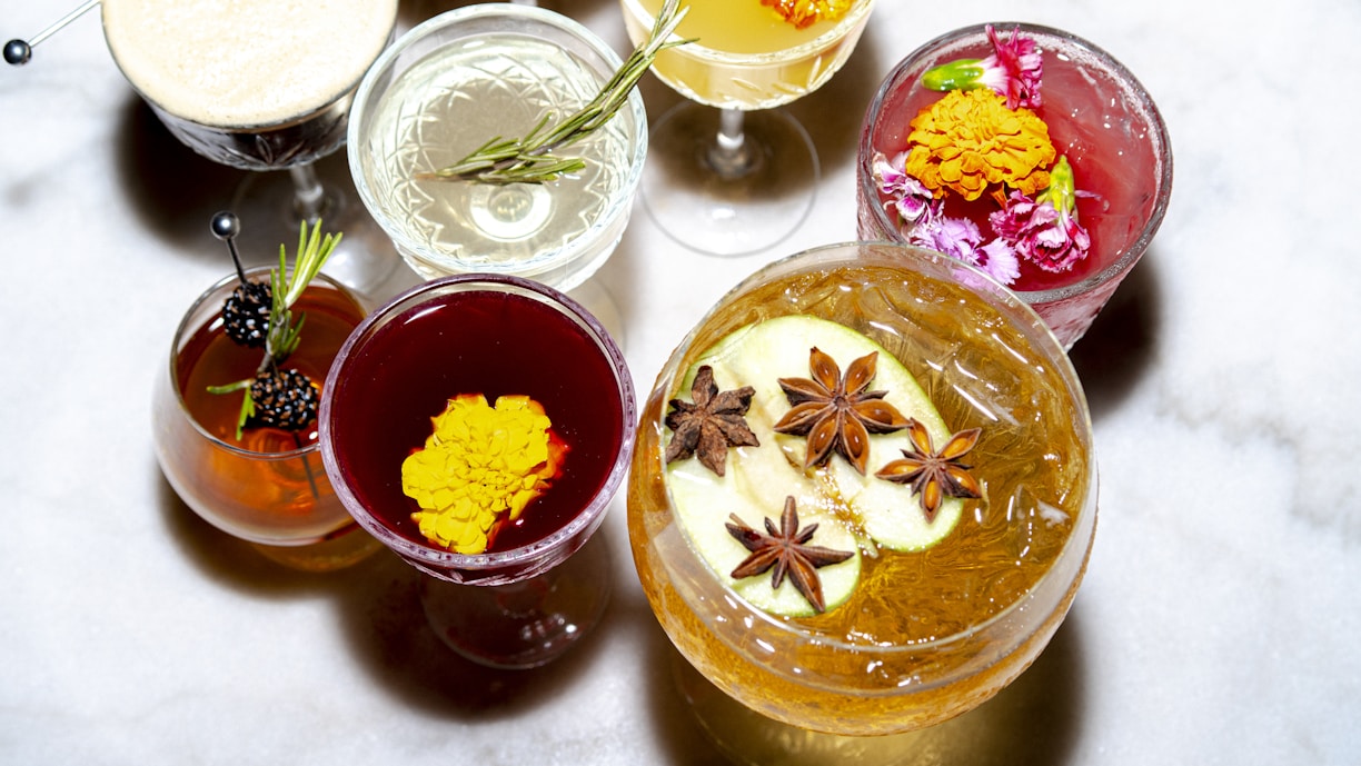 Colorful cocktails decorated with flowers.