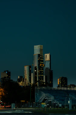 City skyline at dusk with dark blue sky.