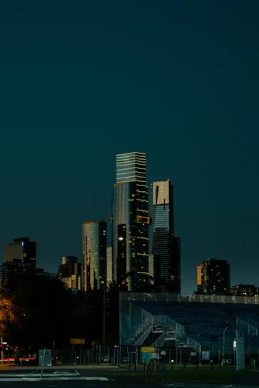City skyline at dusk with dark blue sky.