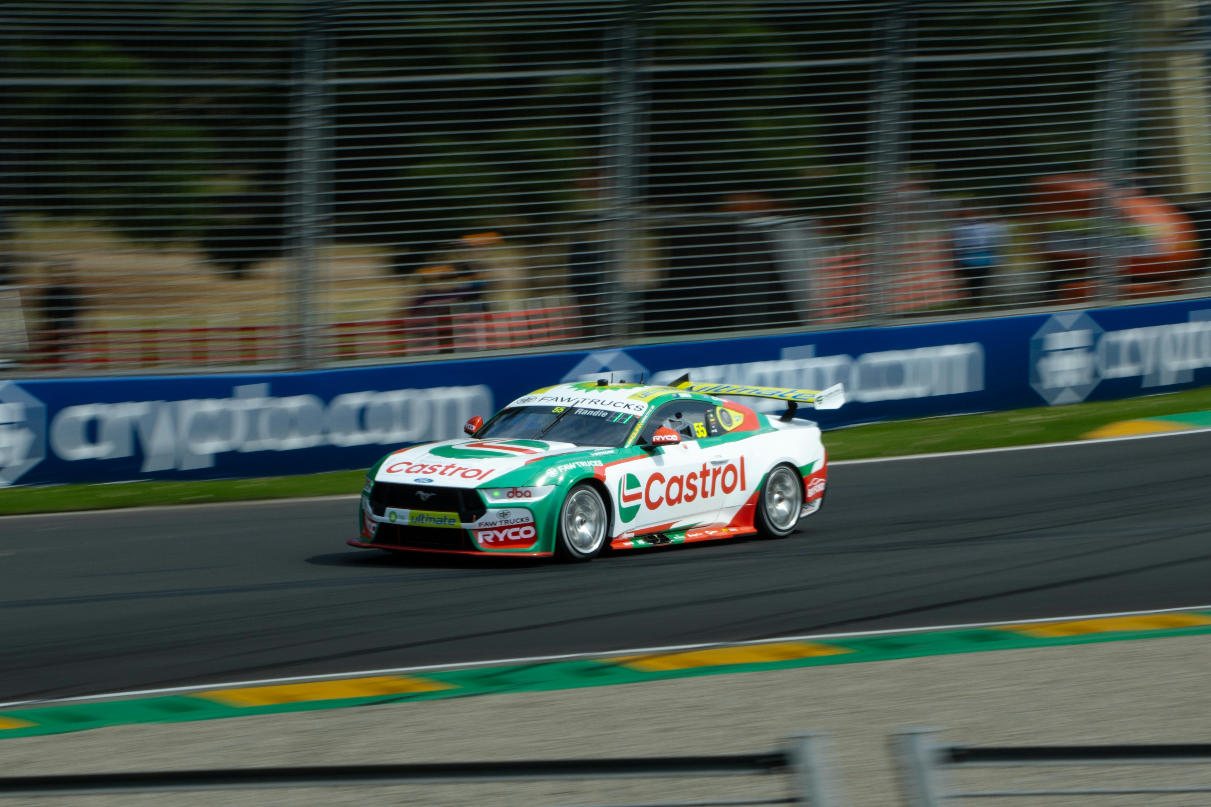 A race car speeds along a track.