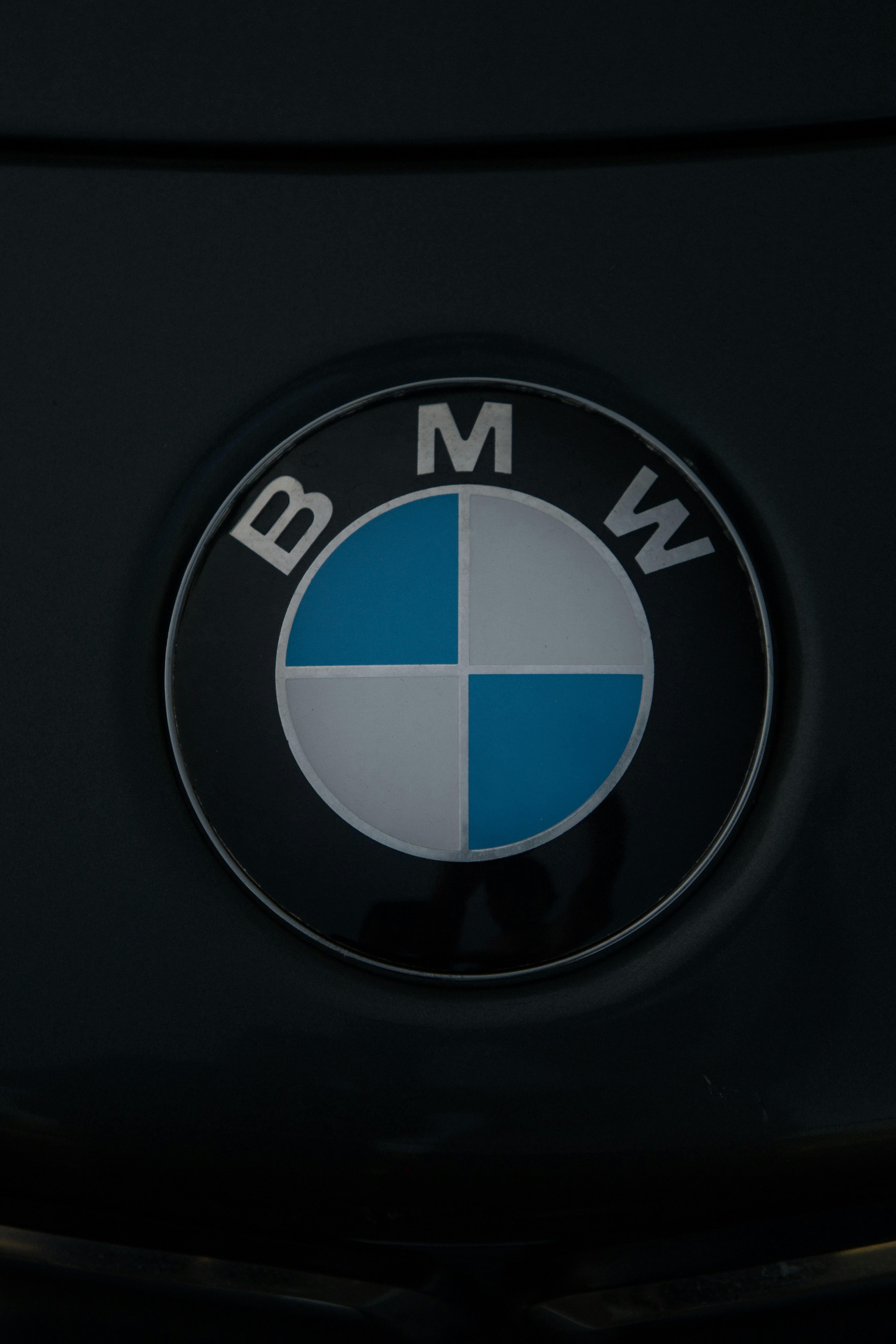 The BMW logo on a dark surface.