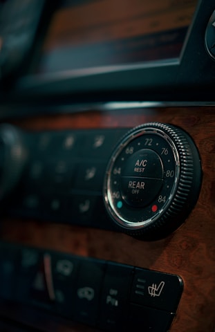 Car's climate control dials.