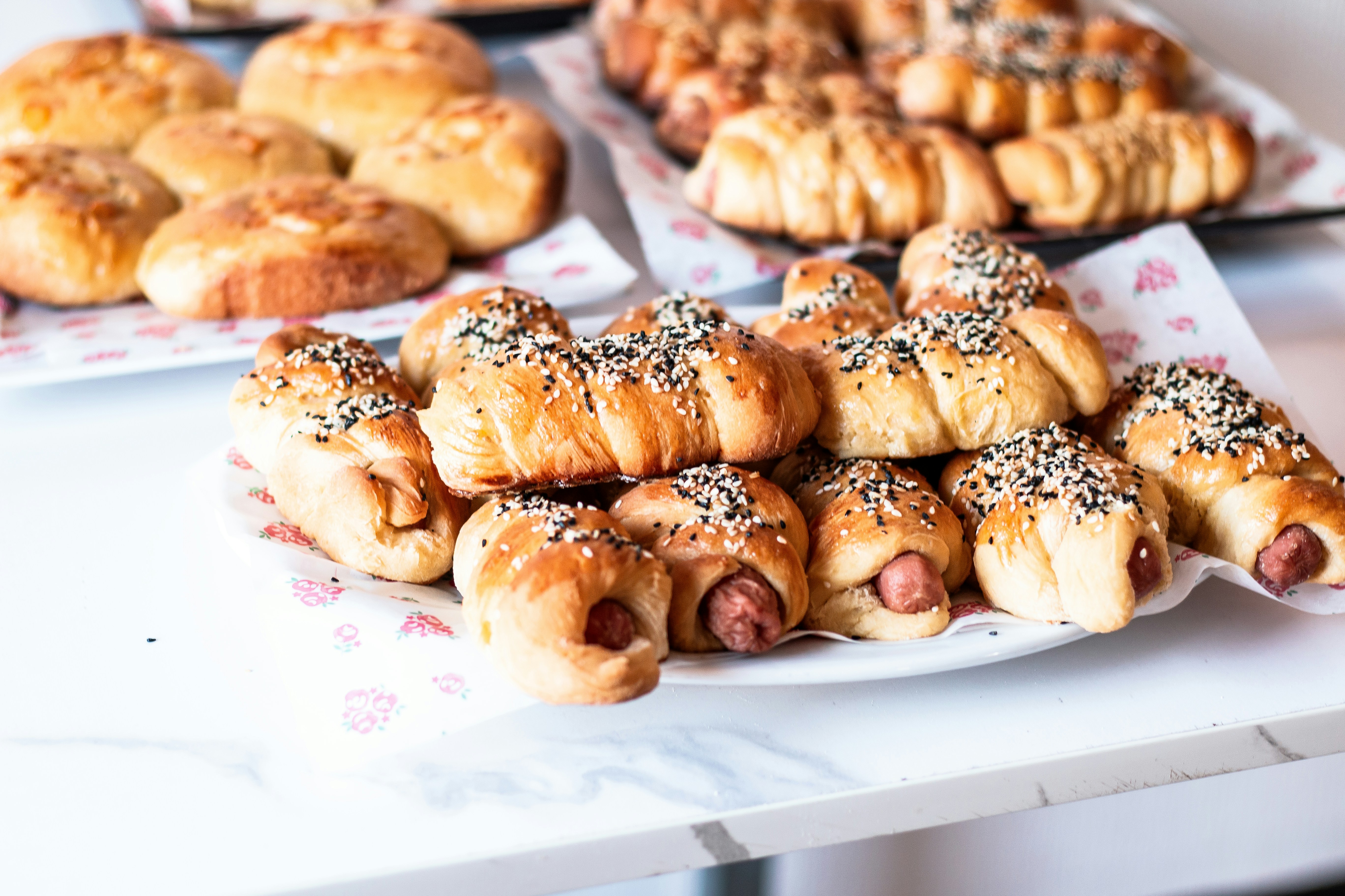Freshly baked pastries and rolls are on display.