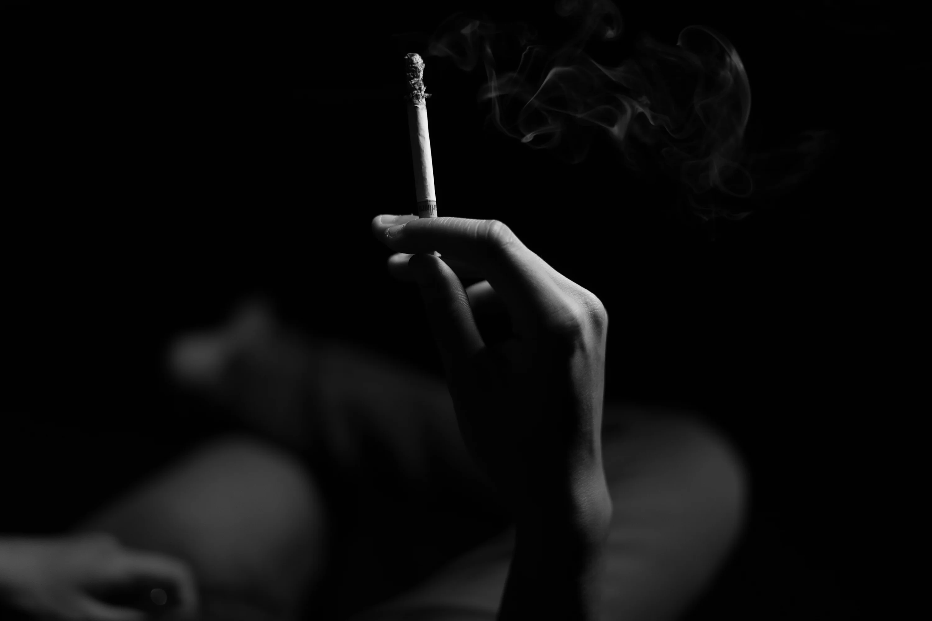 hand hold cigarette Holding A Smoking Greeting Card holding a cigarette in hand