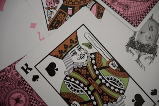Playing cards show the king of spades.