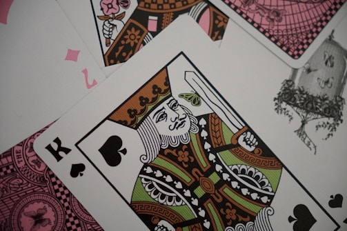 Playing cards show the king of spades.
