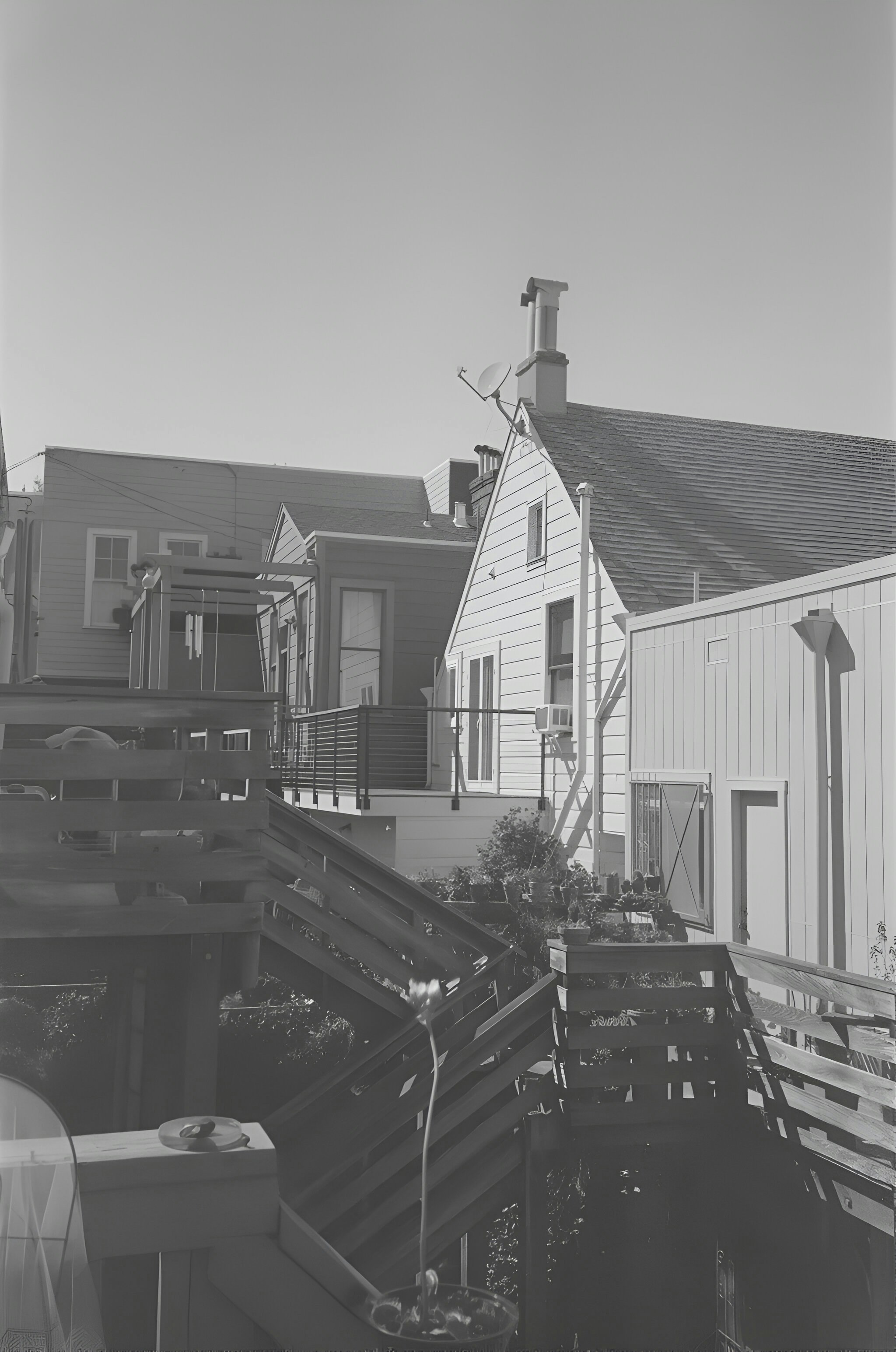 Houses with staircases are visible in the photo