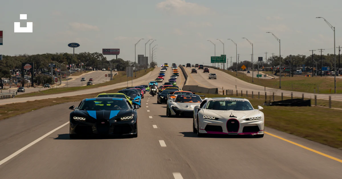 Many Bugatti Many bugatti supercars are driving down the highway. photo – Free ...