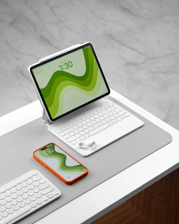 Tablet and phone on a white surface.