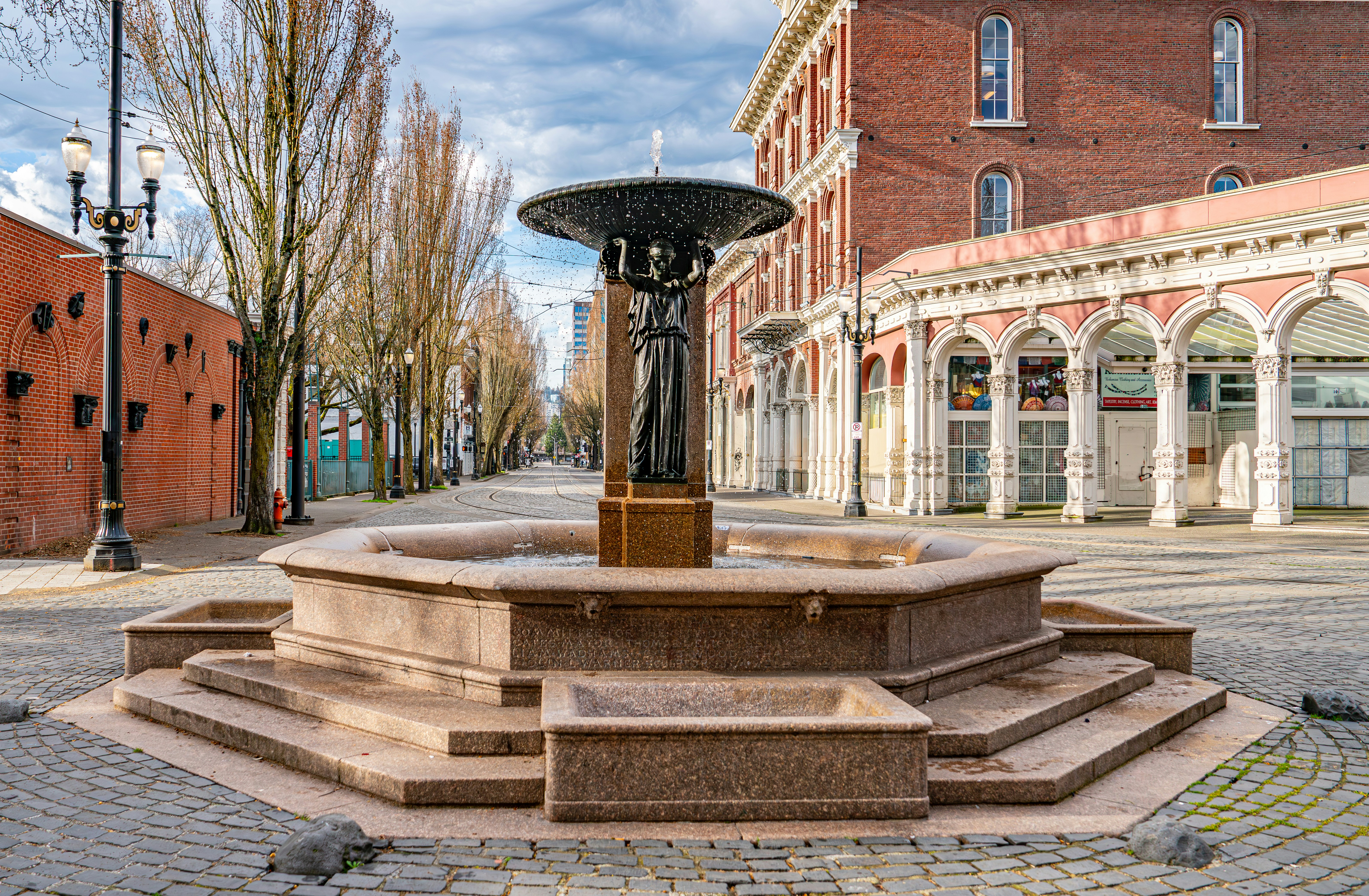 A fountain stands in the city's public square.
