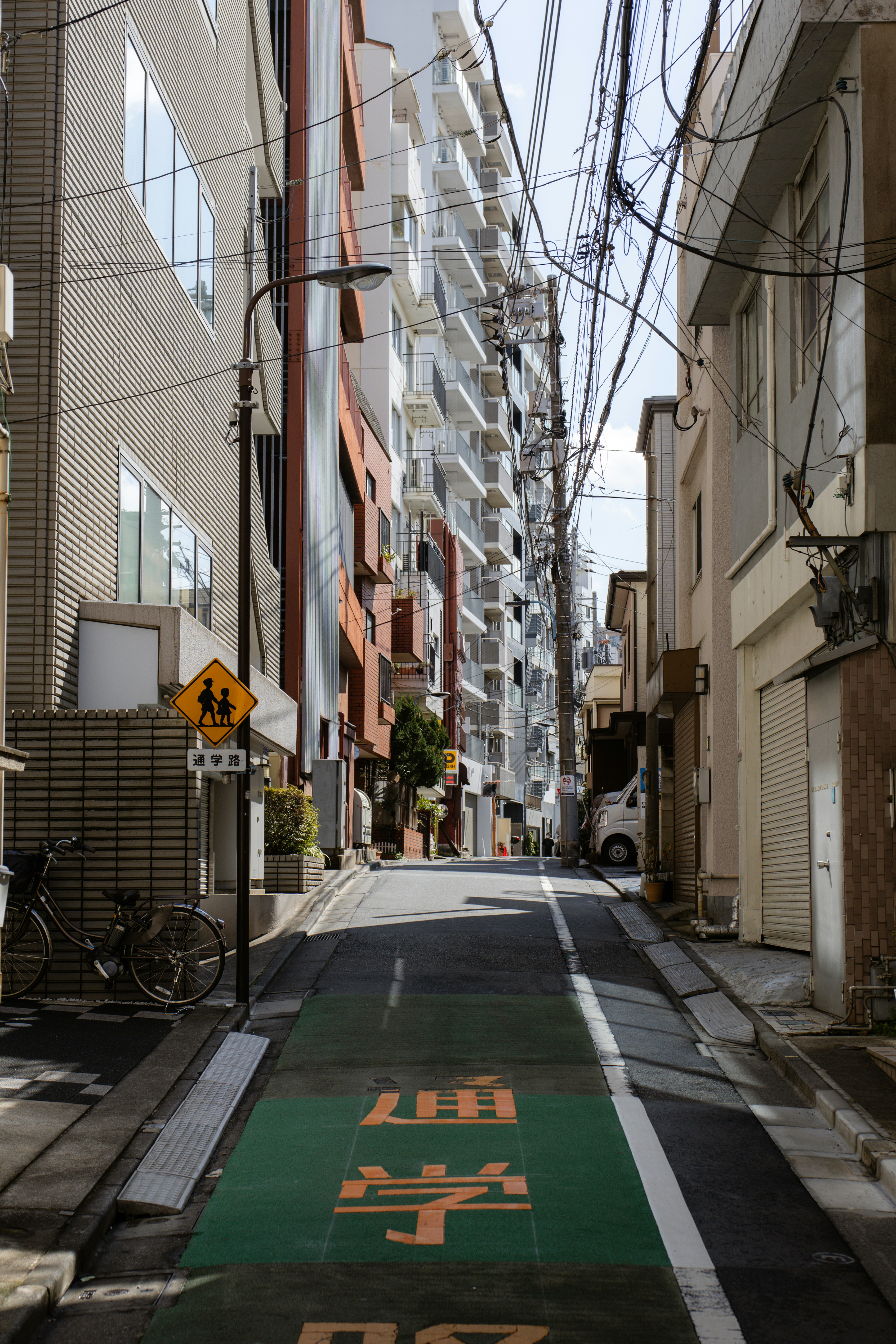 Narrow street in a dense urban area.