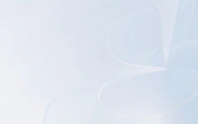 Abstract, flowing white lines on a soft background.