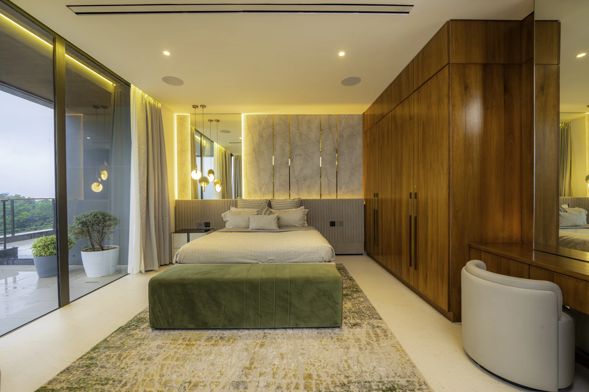 A luxurious bedroom features modern furnishings.