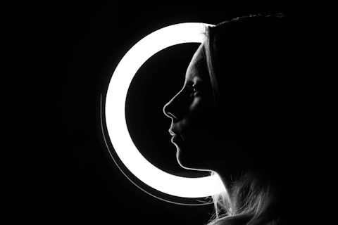 A silhouette of a woman with a halo.