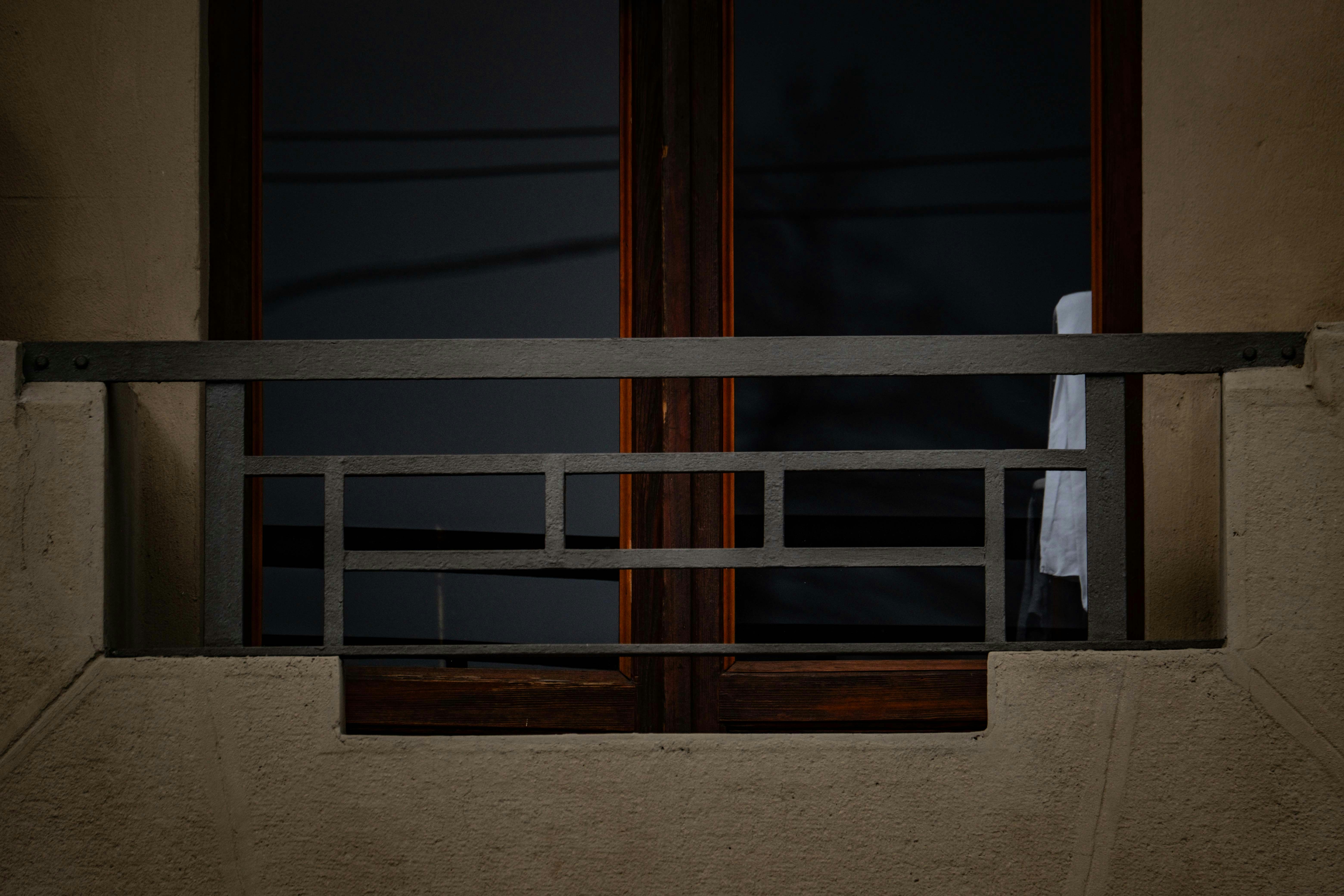 A dark window and a small balcony. photo – Free Window Image on Unsplash