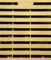 A multi-story parking garage with cars.