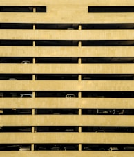 A multi-story parking garage with cars.