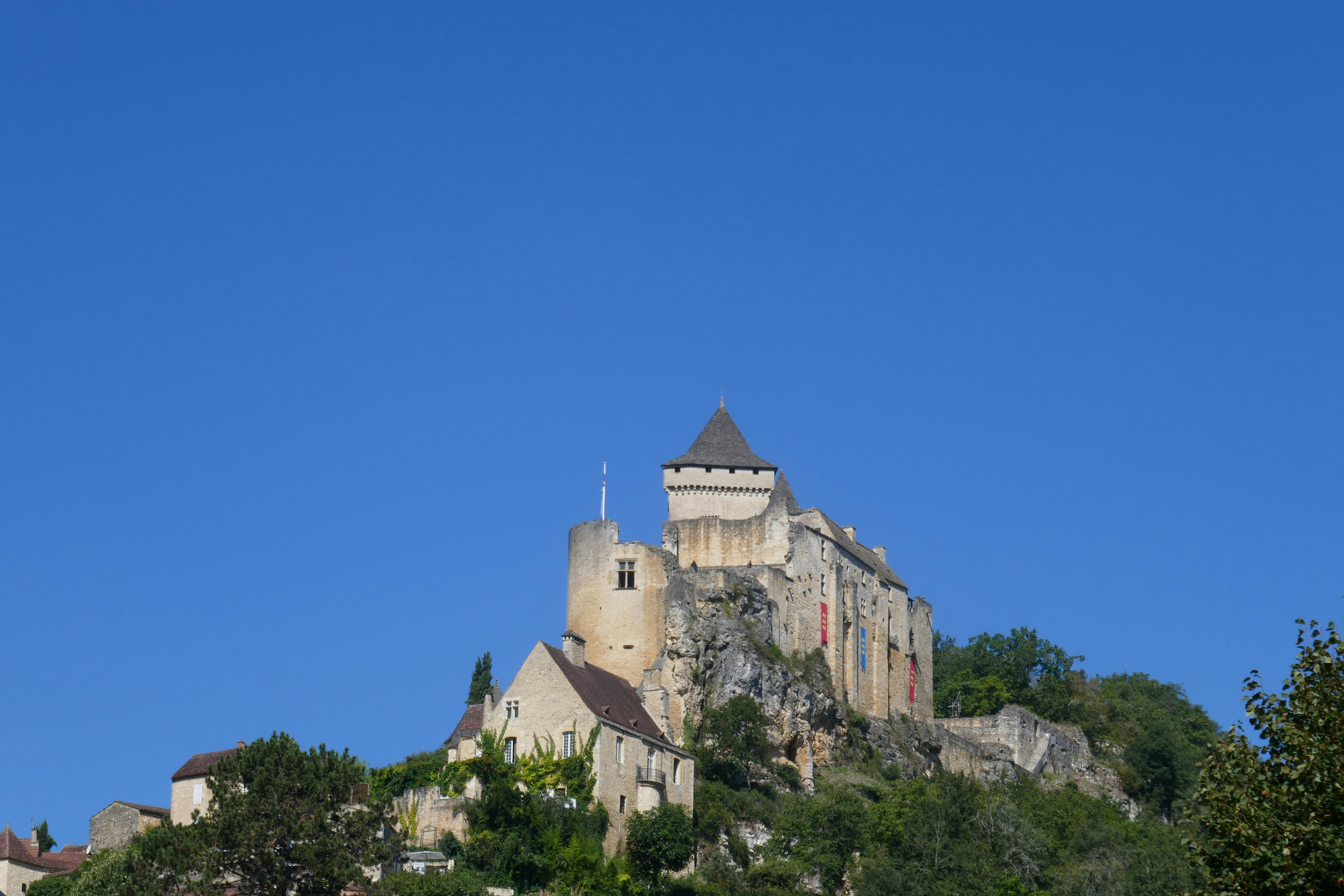 A castle sits high upon a hill.