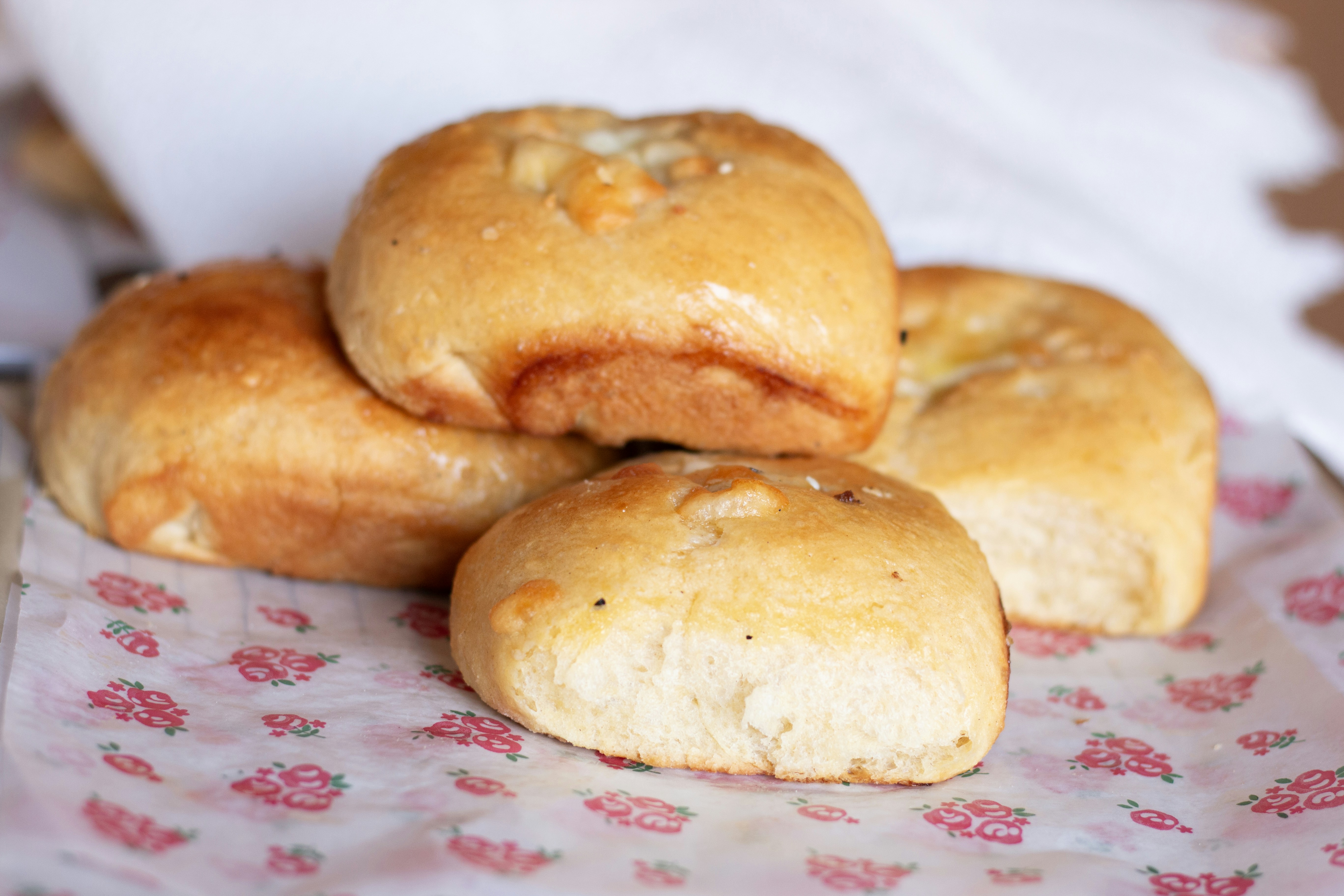 Here's a caption: freshly baked rolls, ready to eat.