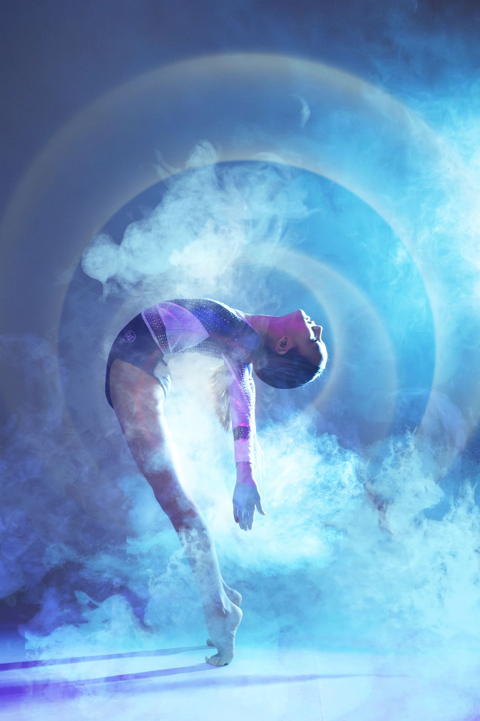 A graceful ballerina dances amidst the fog.