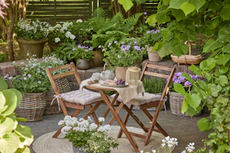 Cozy garden nook with table and chairs.