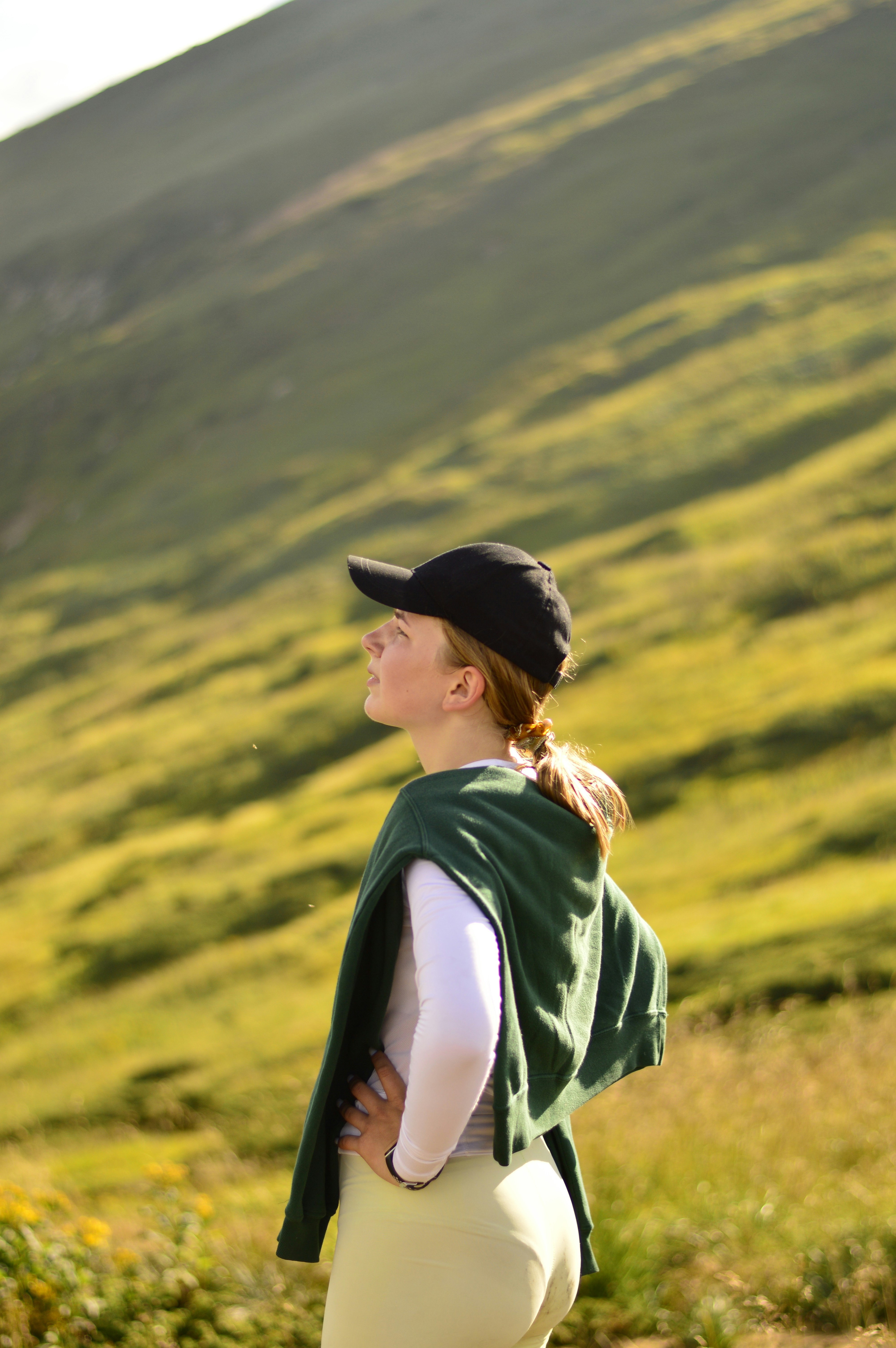 Young woman admiring the view on a mountain