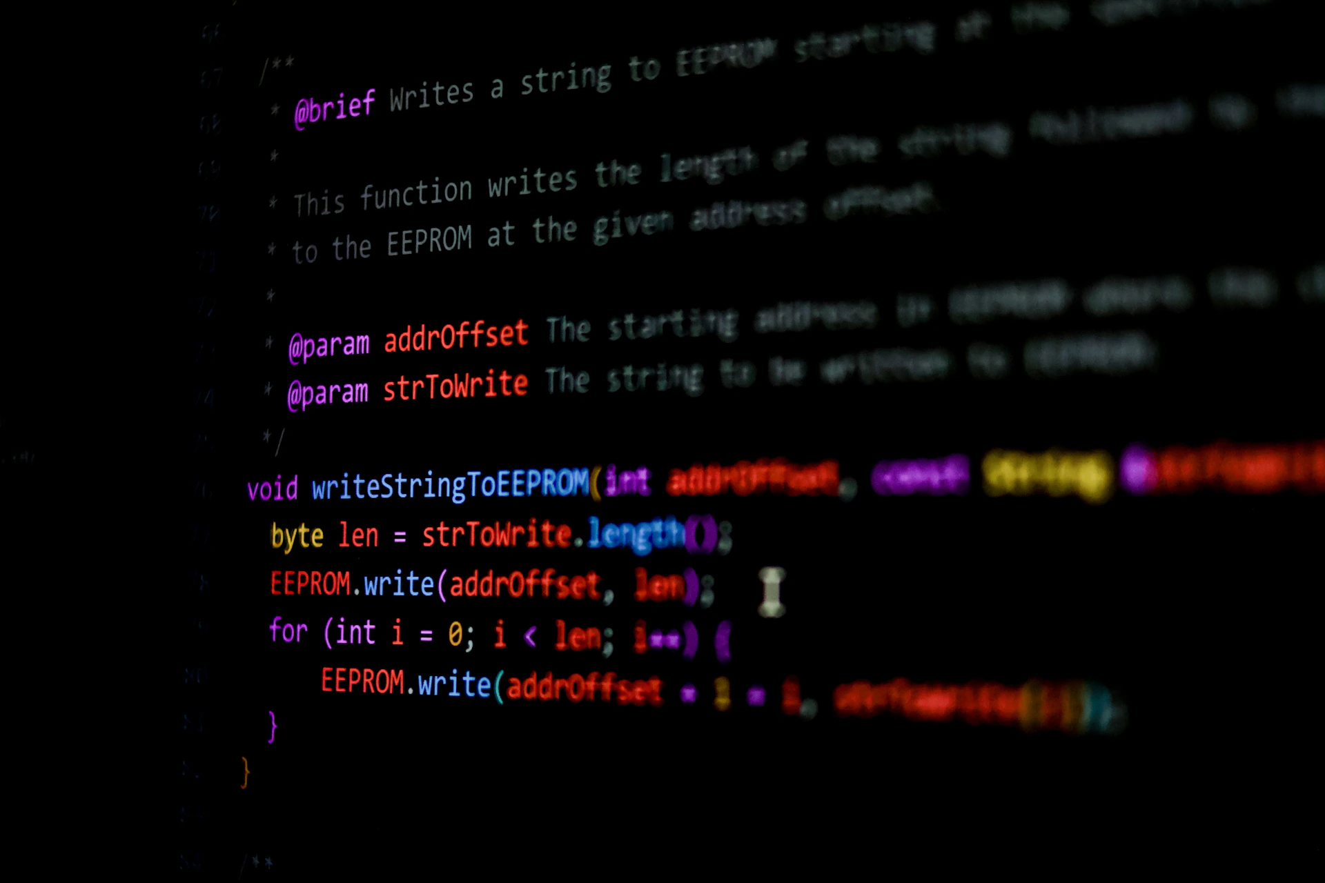 Code appears on a screen.