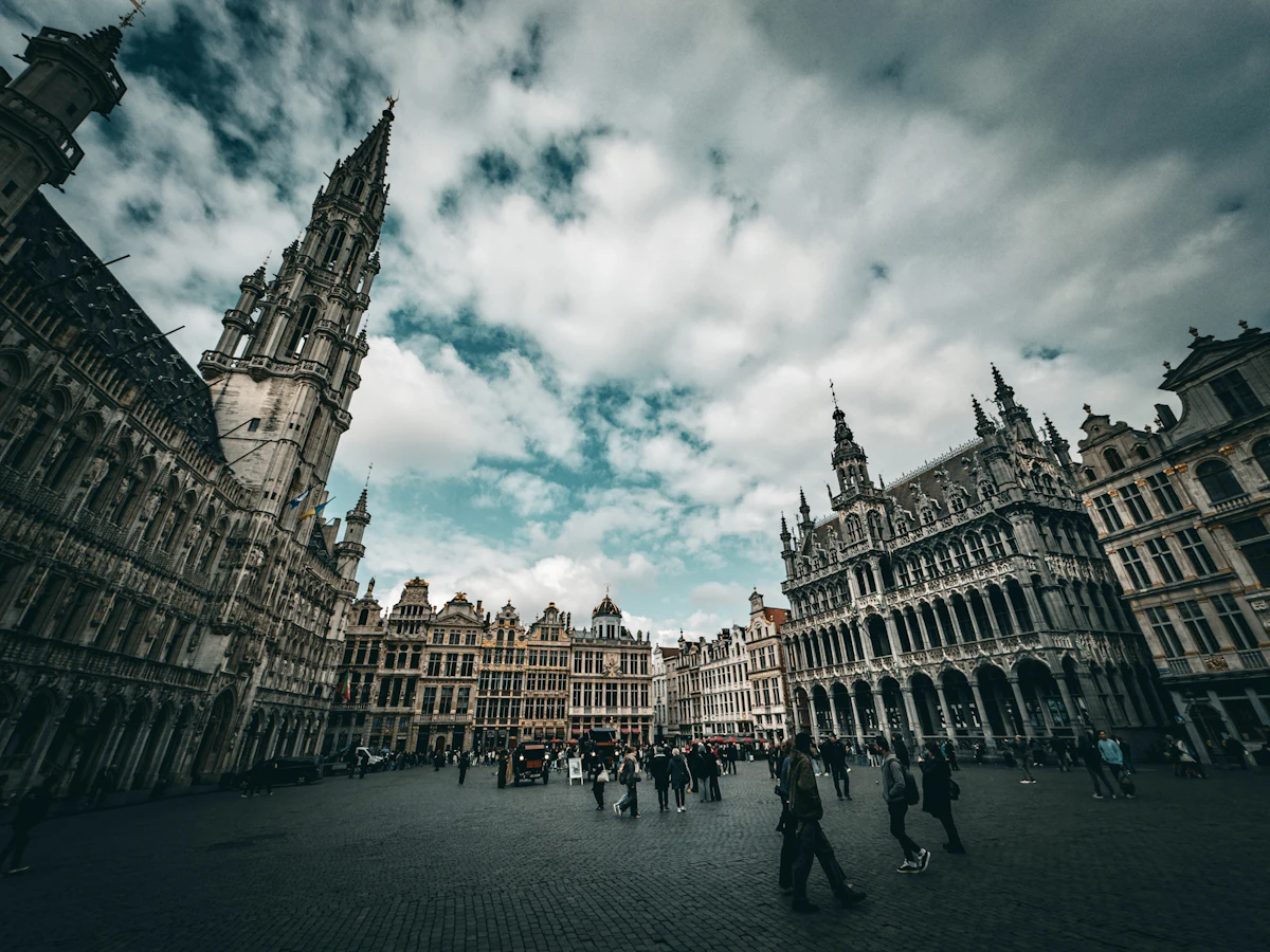 Ornate historic buildings surrounding Grand Place in Brussels