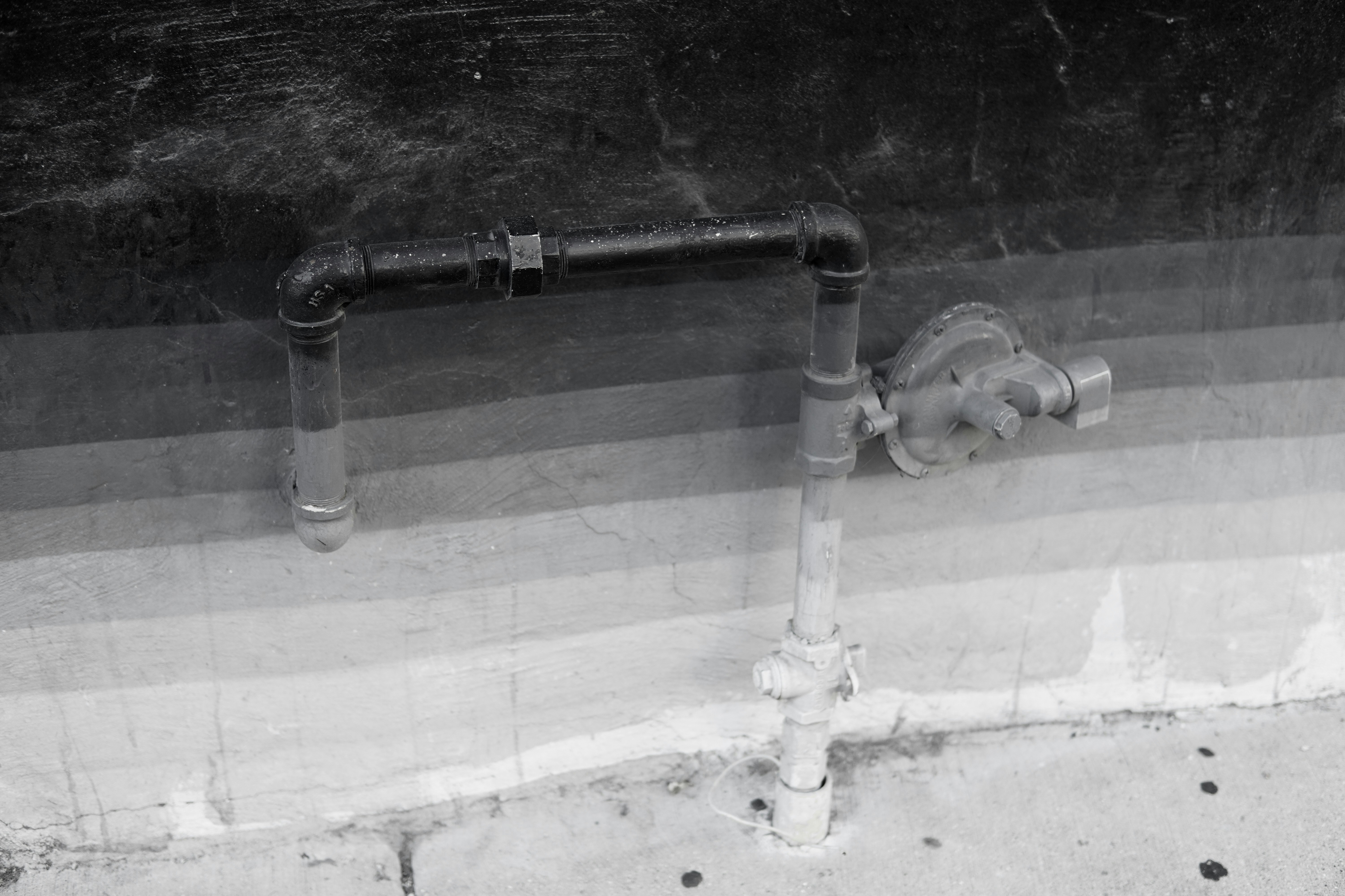 clean and finished interior drainage system installed along a basement wall - basement drainage system near me