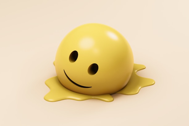 A melting smiley face on a creamy background.