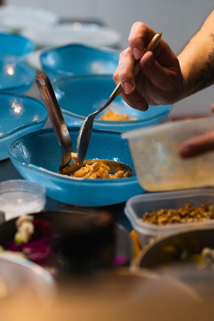 Chef preparing and plating dishes in the Deghchi kitchen
