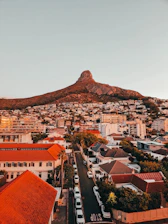 Cityscape with a large mountain in the background.