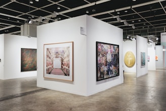 Art is displayed in a modern gallery space.